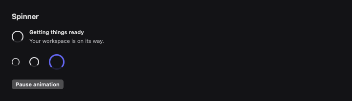 Spinner rendered by native SwiftUI. Dark appearance.